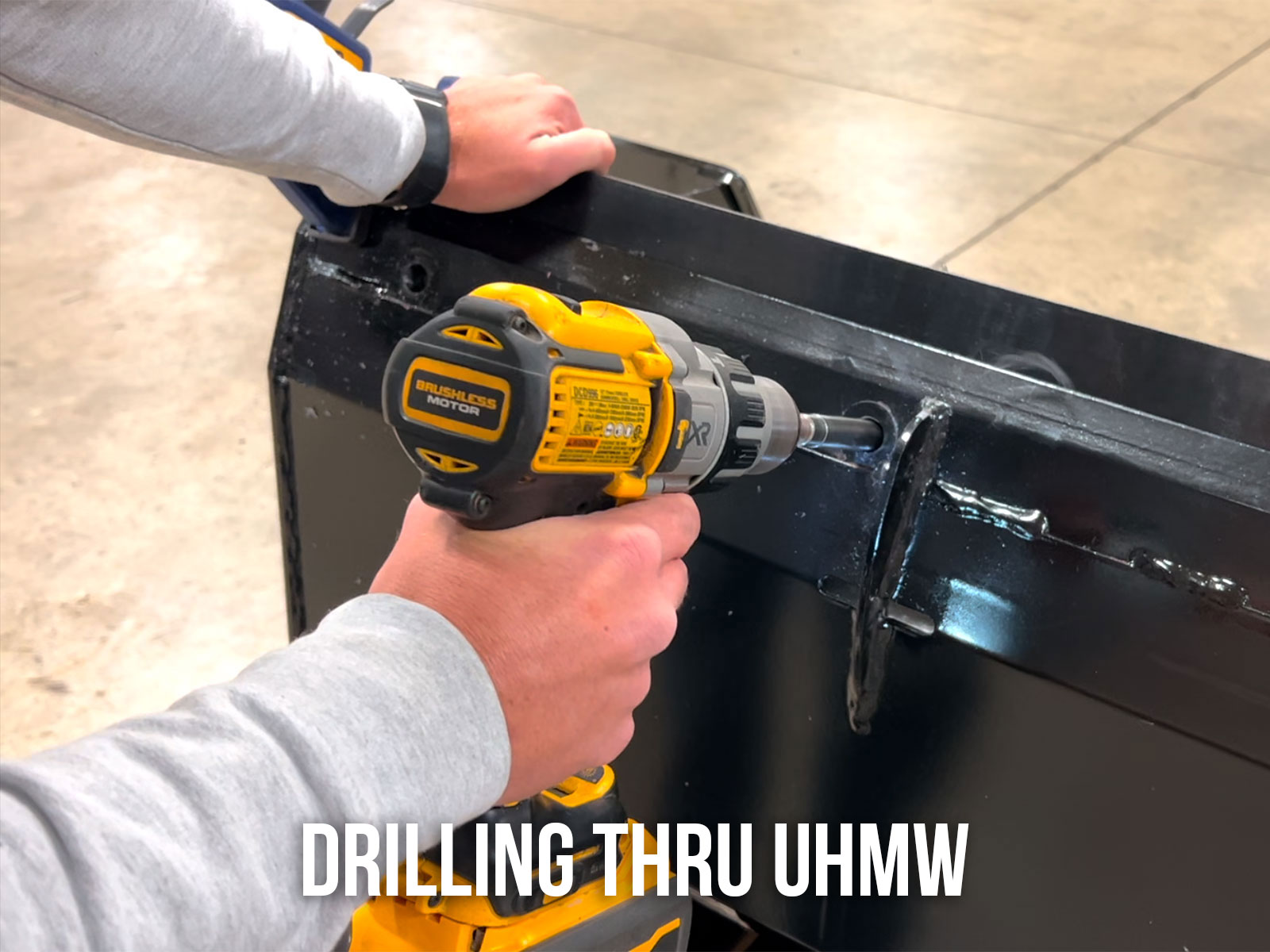 Drilling Through Pre-Drilled Holes in Pusher into UHMW Edge