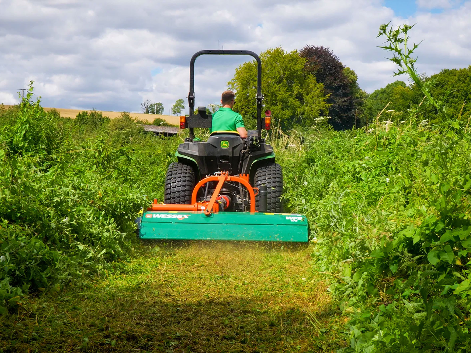Mowing through overgrown brush with WFE Flail Mower